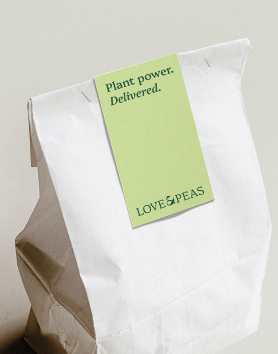 Love & Peas delivery bag with "Plant power. Delivered." label