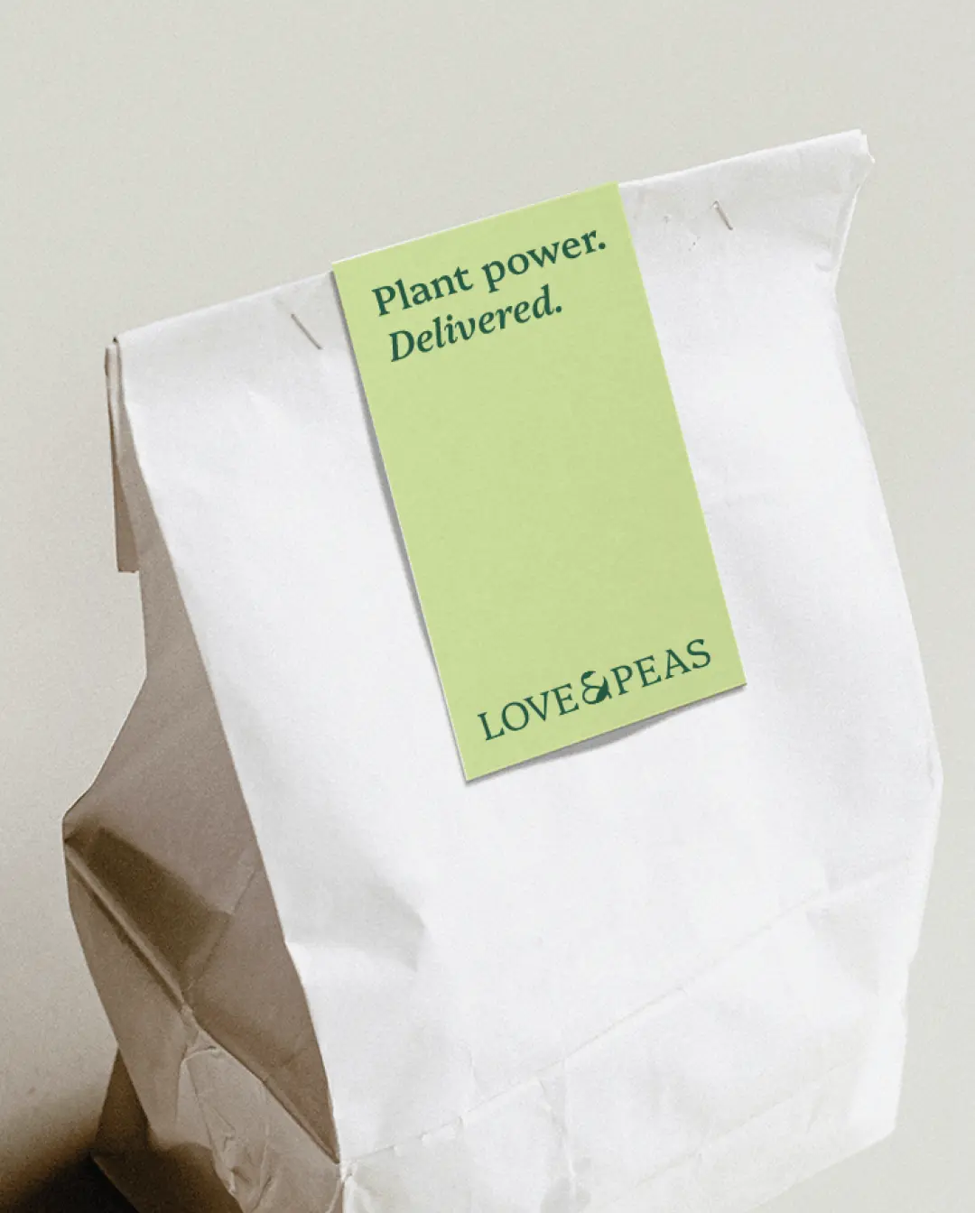 Love & Peas delivery bag with "Plant power. Delivered." label